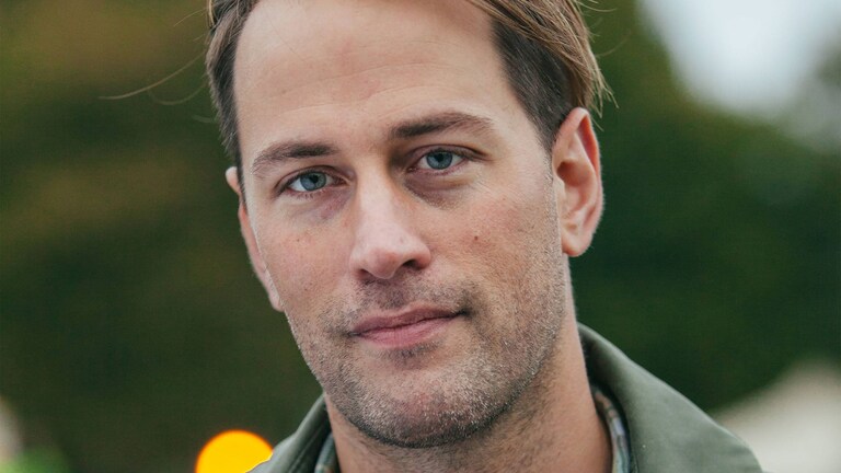 Kameraan hymyilevä Tristram Stuart